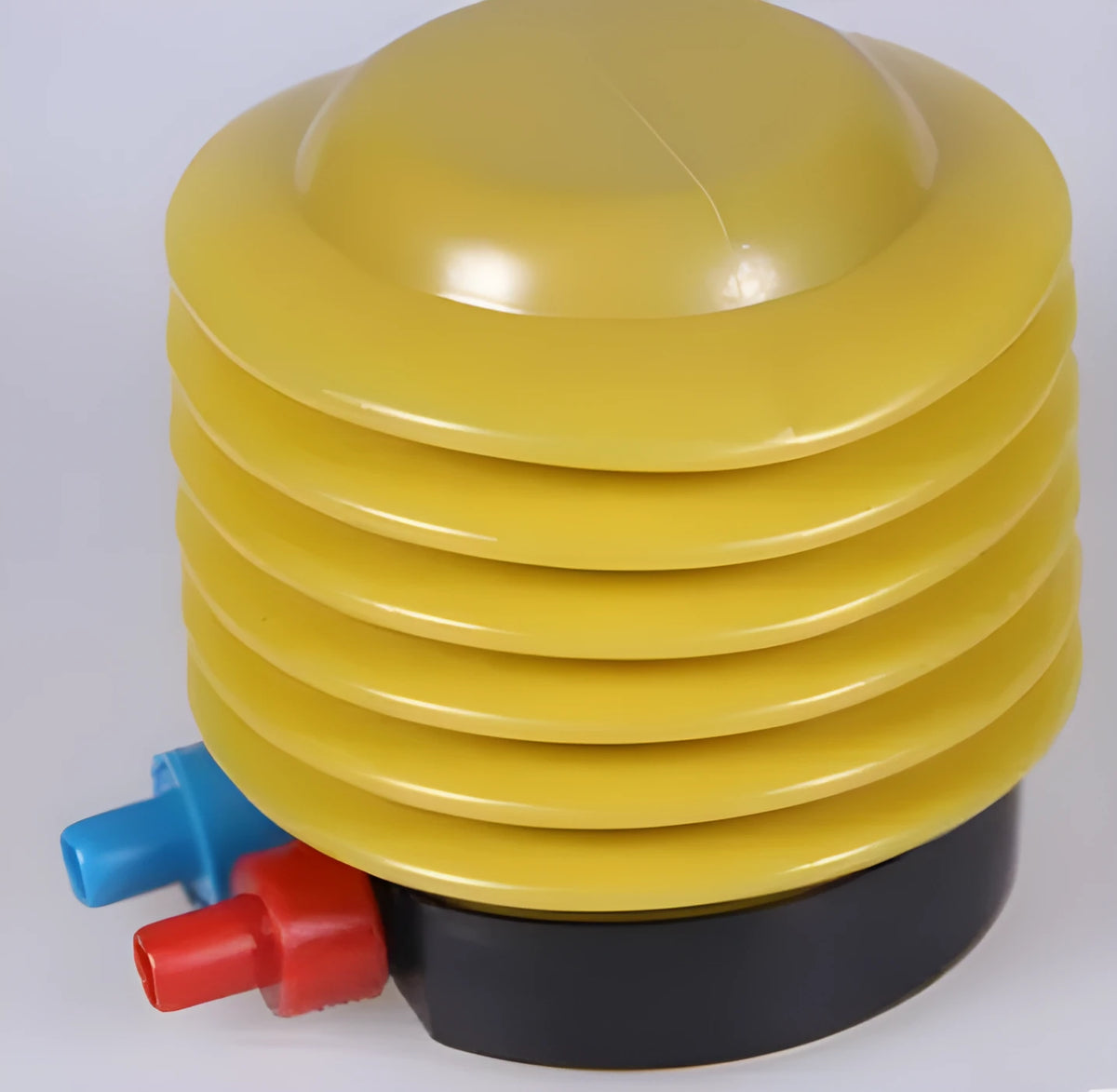 Blue and red plastic pedal foot pump for inflating swim rings and pool toys.