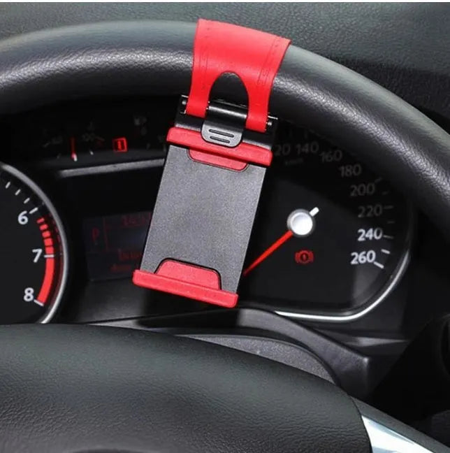 Black steering wheel phone mount with elastic clip and silicone padding for smartphones