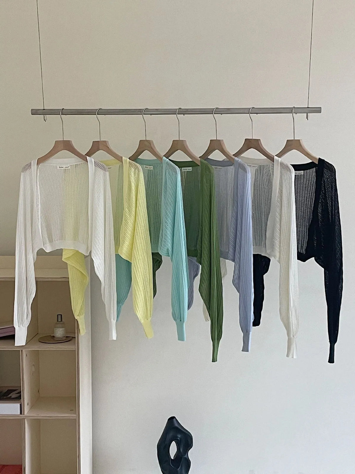Women's hollow out blouse with long lantern sleeves in a linen blend fabric, shown in apricot colour.