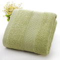 Thickened cotton blend bath and beach towel in solid colour options including green, blue, and pink.