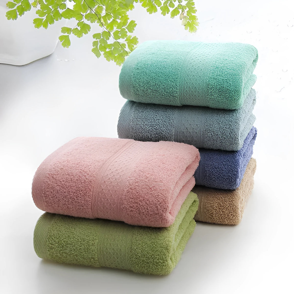 Thickened cotton blend bath and beach towel in solid colour options including green, blue, and pink.