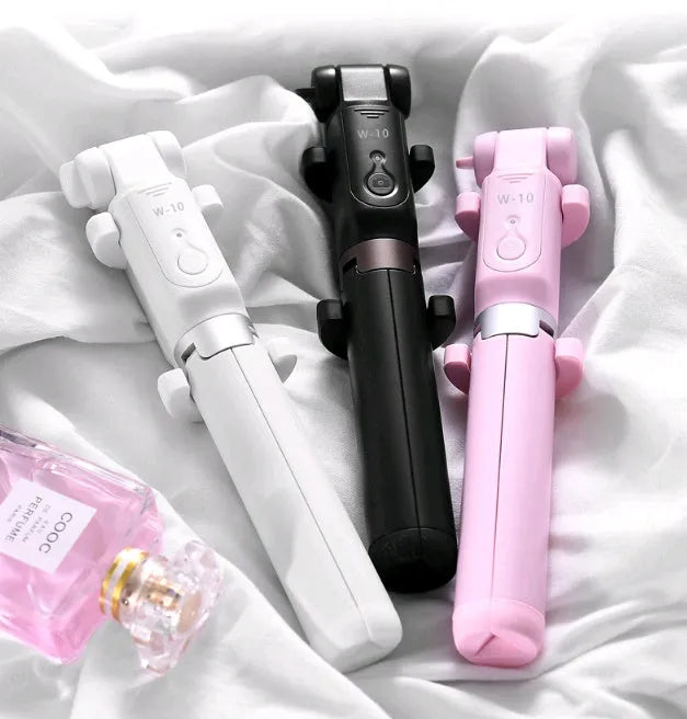 Black Bluetooth selfie stick with extended phone clamp and folded tripod legs
