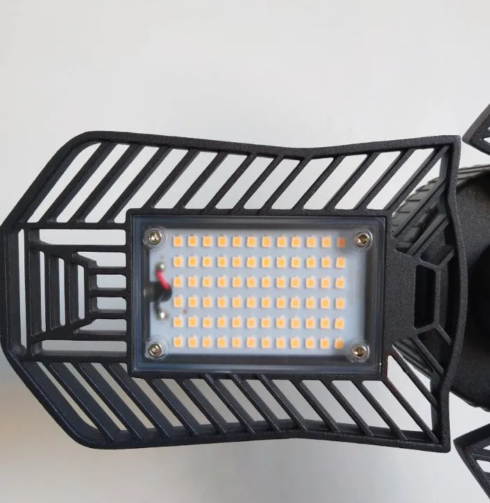 Waterproof industrial foldable garage LED lamp with die-cast aluminium housing in open position