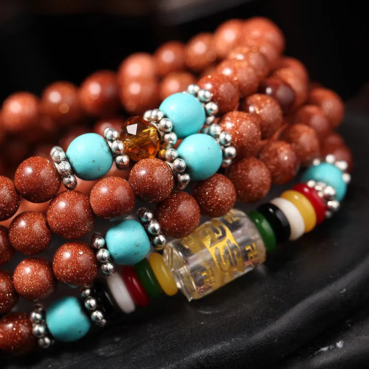 Golden star stone mantra bracelet with 108 sand beads and fu character ornament