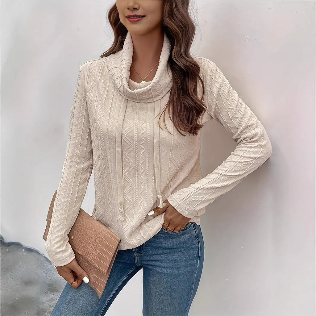 Apricot coloured hooded pullover sweater with long sleeves and drawstring adjustment