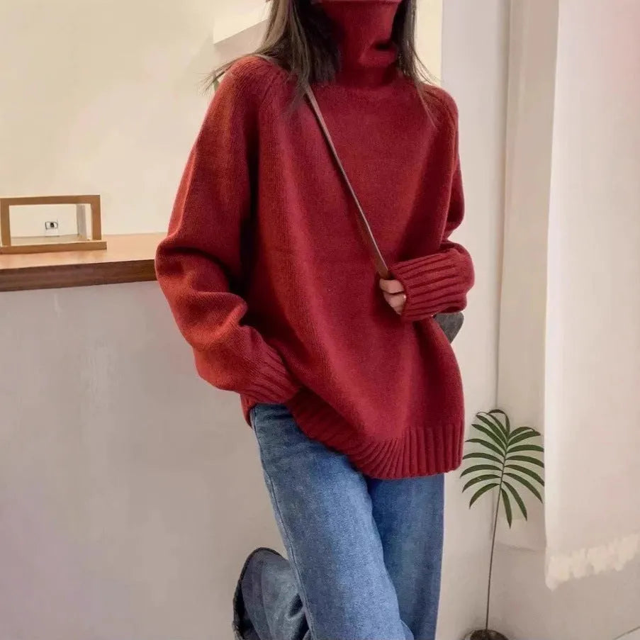 Women's loose fit thick turtleneck sweater with a 3D curling pile collar in red.