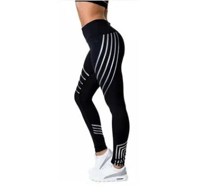 Women's black workout leggings with a glowing print, shown in a slim-fit pencil pants style.