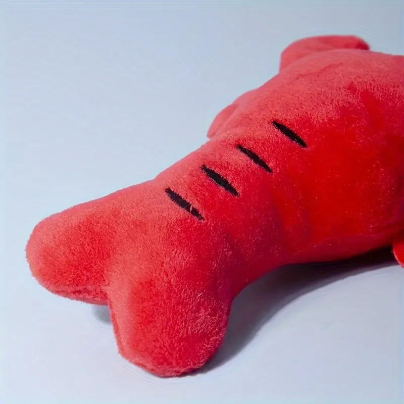 Red lobster stuffed squeaky dog toy for small and medium breeds on white background
