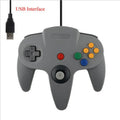 Blue USB N64 game controller for PC computer on a desk.