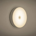 USB rechargeable motion sensor LED night light with adhesive mounting in beige or white