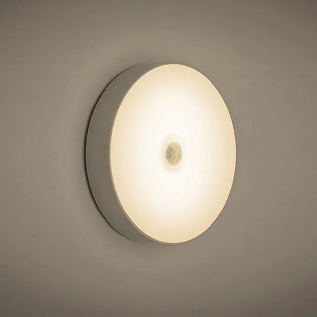 USB rechargeable motion sensor LED night light with adhesive mounting in beige or white