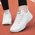 Women's high-top casual sneakers with PU upper and cross-bind straps in white colour