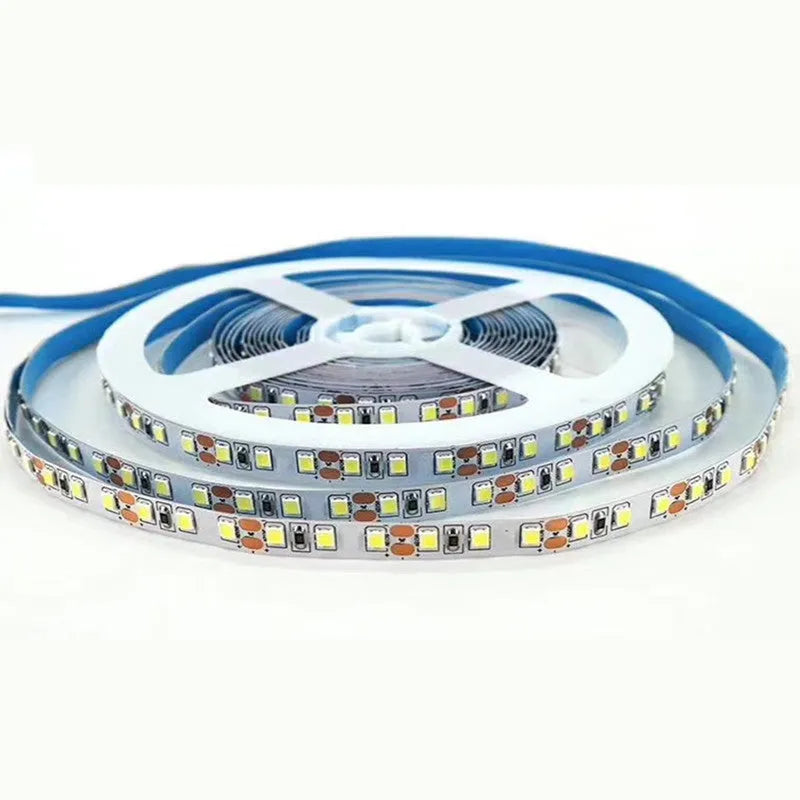 Close-up of a flexible white LED light strip with densely packed chips on a soft diffuser coating.