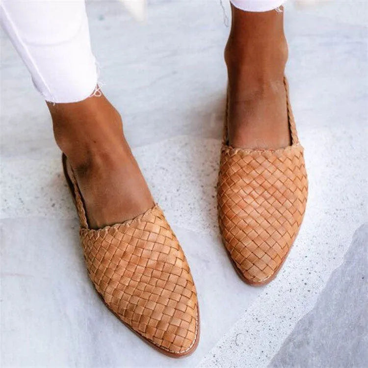 Pointed-toe flat sandals with an instep buckle strap, shown in one of six available colours.