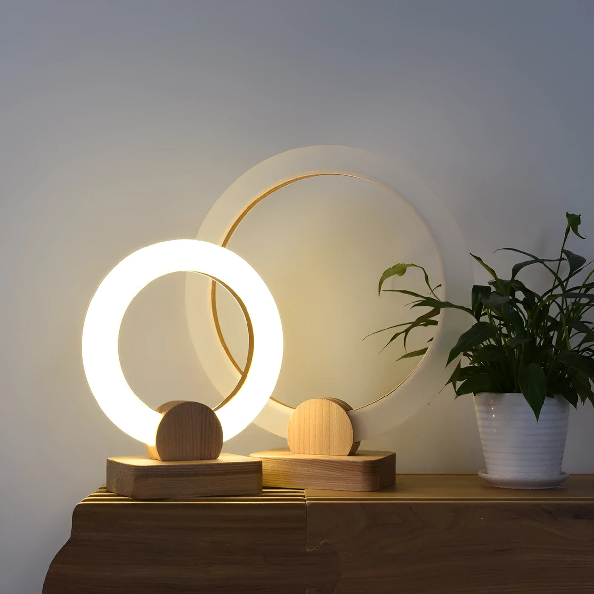 Nordic style circular wooden art chandelier with round acrylic shade, shown in two diameter sizes