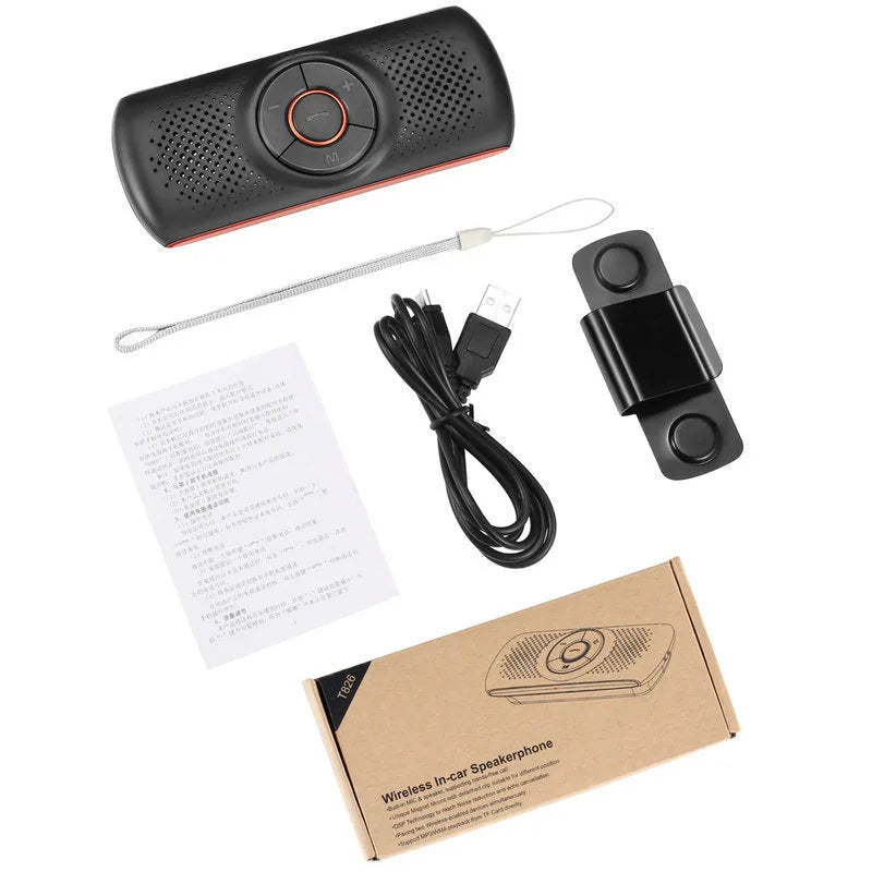 Orange plastic Bluetooth hands-free car speaker mounted on a sun visor for wireless smartphone calls and music.