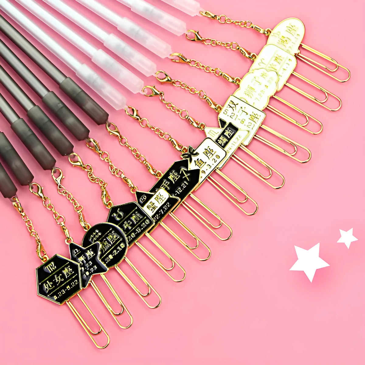 Pack of 12 black gel pens with 0.5mm tips in various constellation-themed designs on a white background