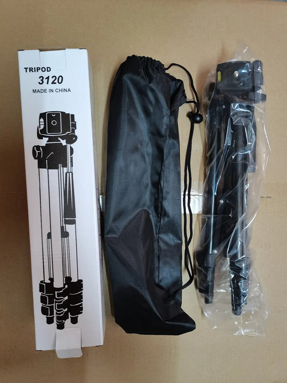 Black aluminium portable camera tripod with quick-release plate extended to medium height