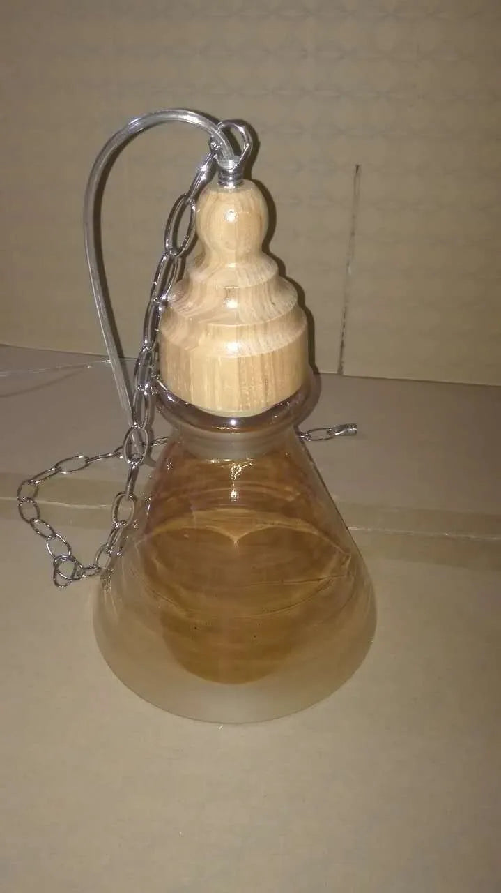Glass wood grain single head pendant light with adjustable cord in a Nordic style setting