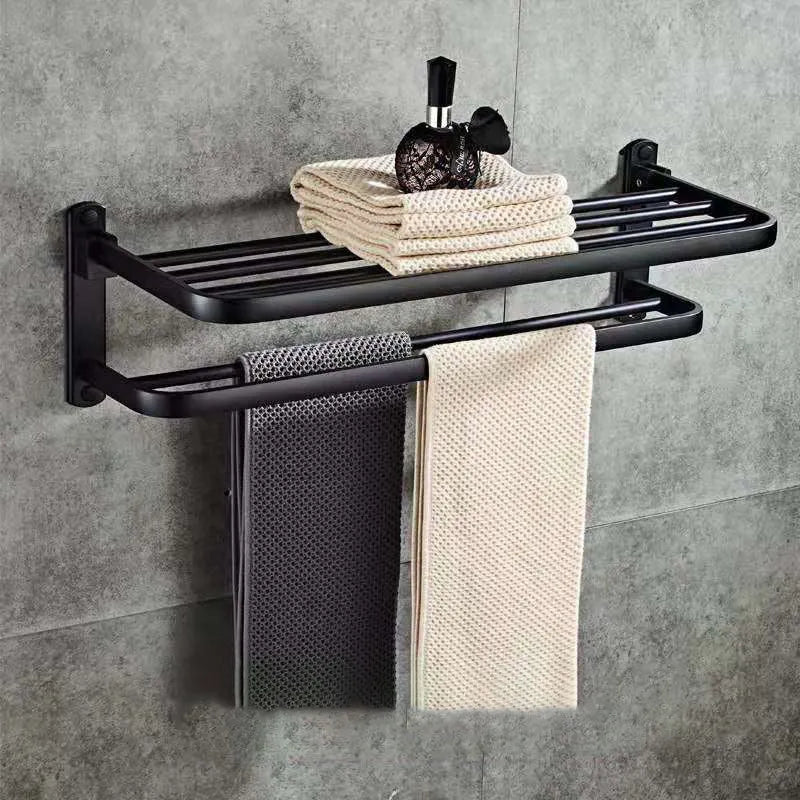 Modern aluminium folding bathroom shelf with two tiers, shown in a size with perforated panels and hooks.
