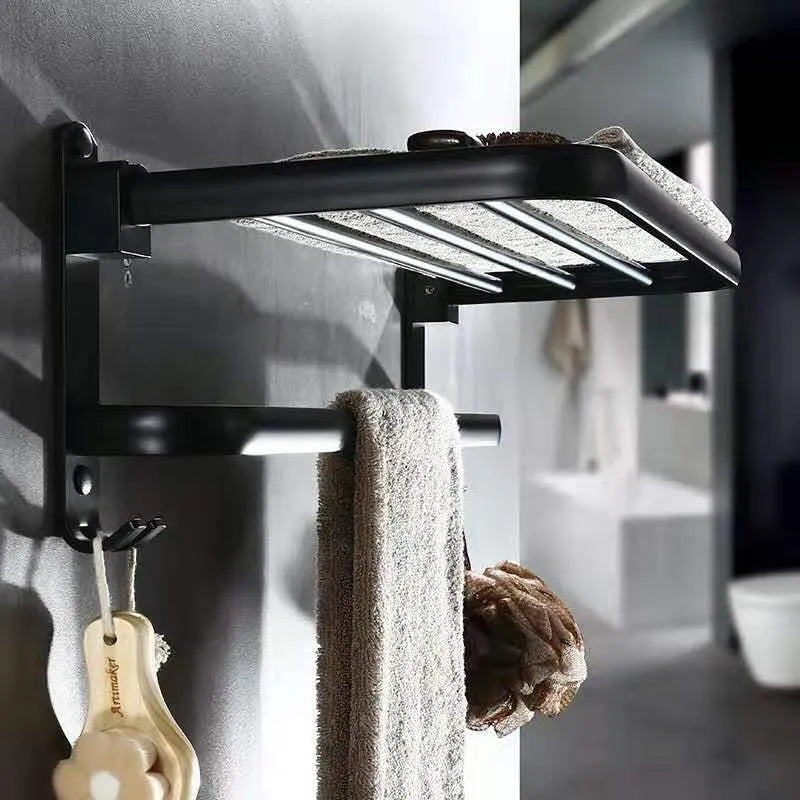 Modern aluminium folding bathroom shelf with two tiers, shown in a size with perforated panels and hooks.