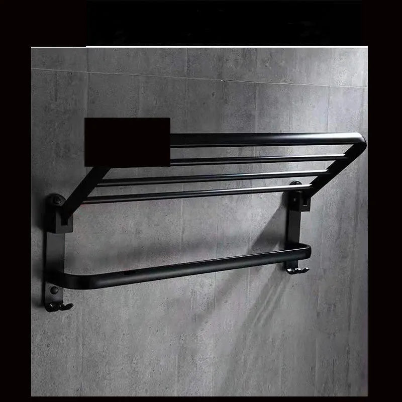 Modern aluminium folding bathroom shelf with two tiers, shown in a size with perforated panels and hooks.