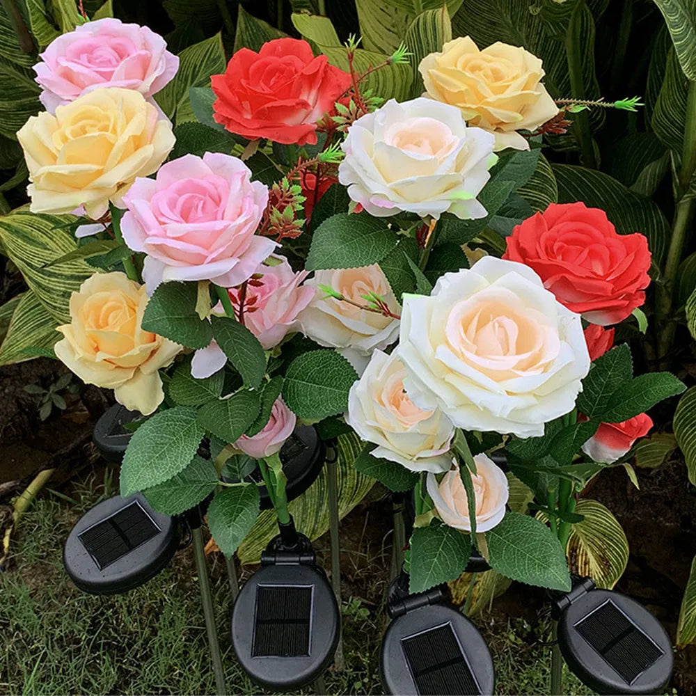 Outdoor solar rose garden lamp with three heads on an 80cm stake, showing pink silk cloth roses with LED illumination.