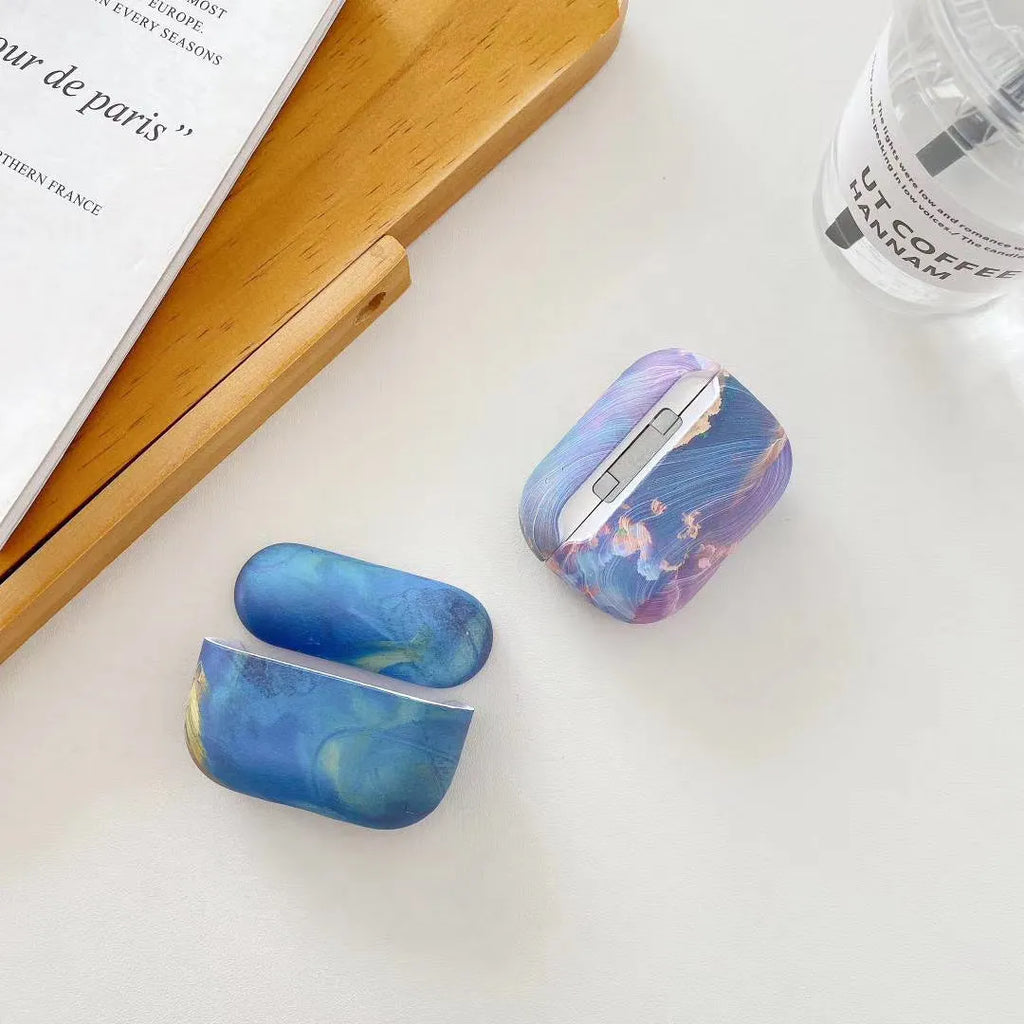Blue and pink watercolour hard shell protective cases for Apple AirPods Pro and AirPods 1/2 charging cases.