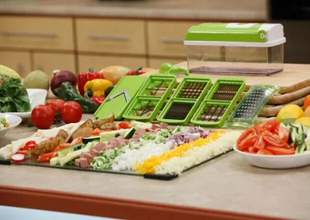 Green ABS plastic vegetable chopper with stainless steel blades and 12 kitchen accessories for manual food preparation