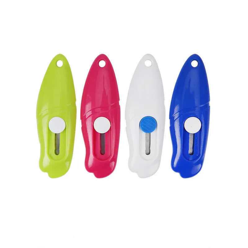Cartoon-shaped art knife in plastic and metal, shown in various styles including Miffy and Robot designs.