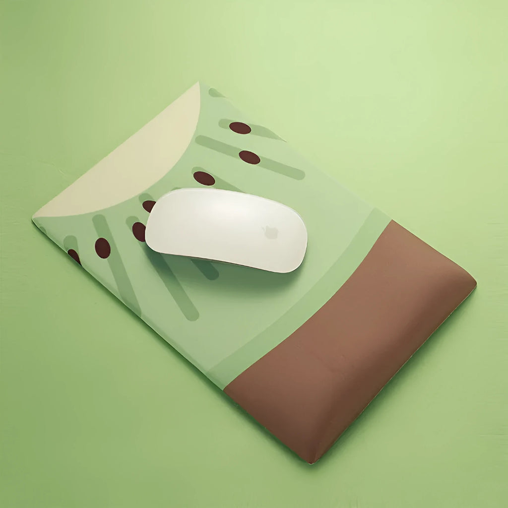 Cute design silicone and cloth wrist mouse pad with thickened support, shown on a desk.