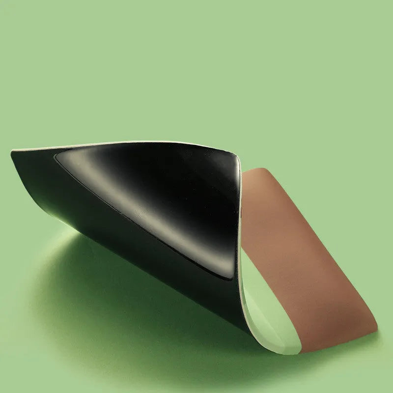 Cute design silicone and cloth wrist mouse pad with thickened support, shown on a desk.
