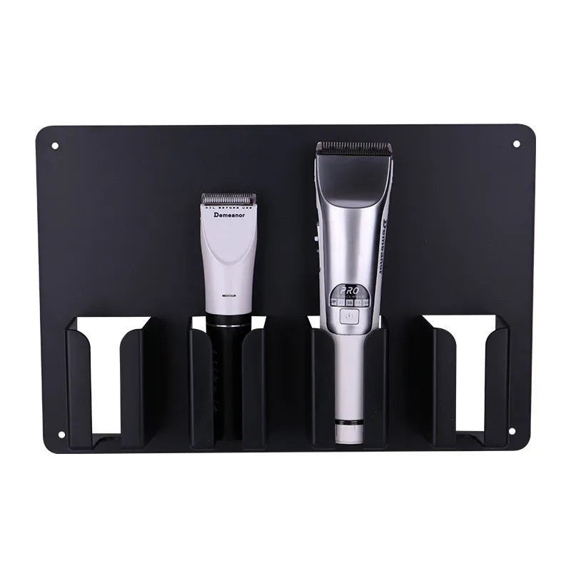 Black plastic wall-mounted rack holding four hair clippers with space for brushes and combs.
