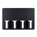 Black plastic wall-mounted rack holding four hair clippers with space for brushes and combs.