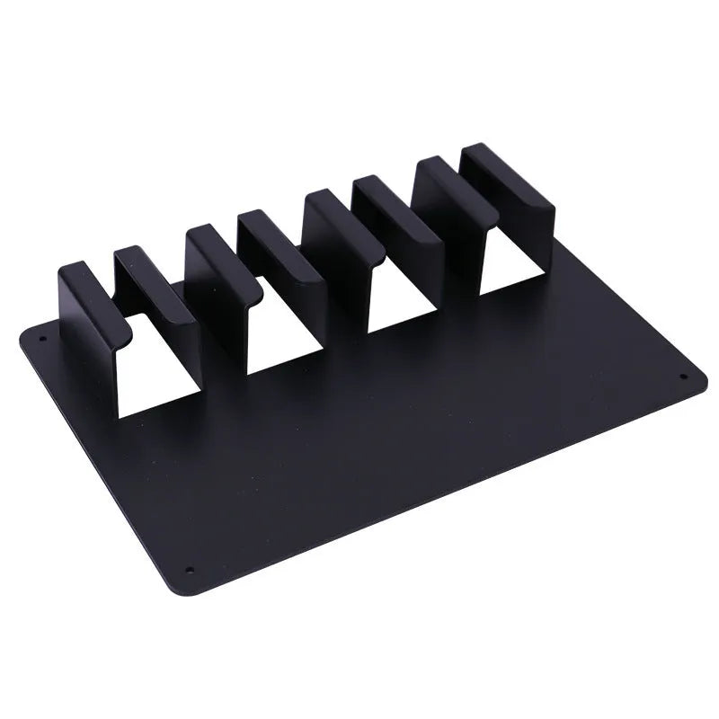 Black plastic wall-mounted rack holding four hair clippers with space for brushes and combs.