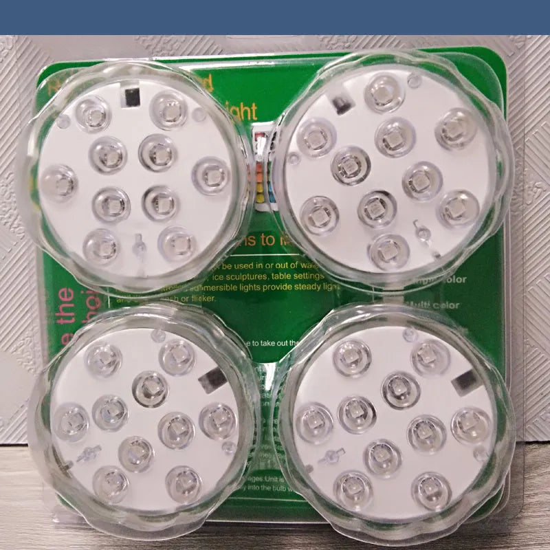 White IP68 waterproof LED diving light with remote control for pools and gardens.