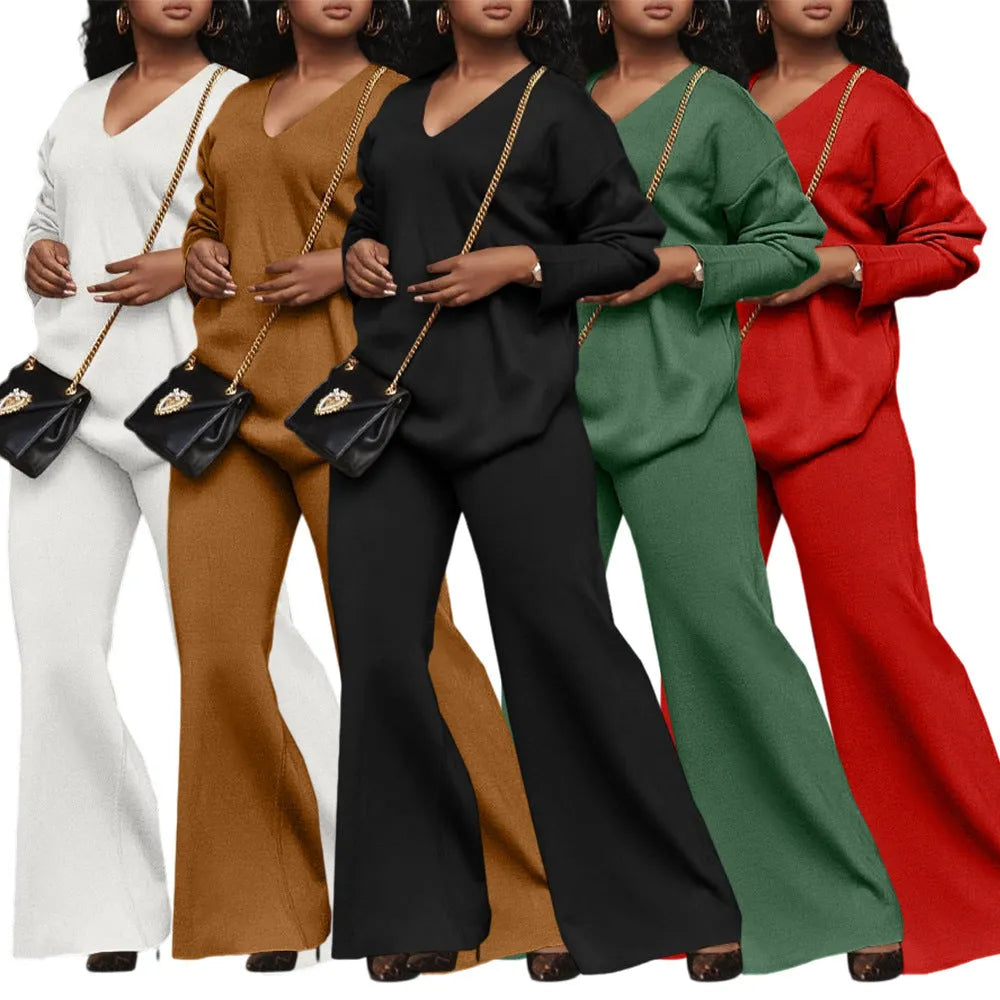 Brown women's casual two-piece suede suit with split sleeve top and trousers on a model.