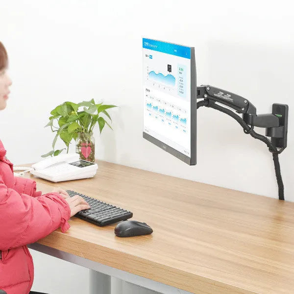 Black wall-mounted adjustable computer monitor stand with telescopic arm and rotating screen bracket.