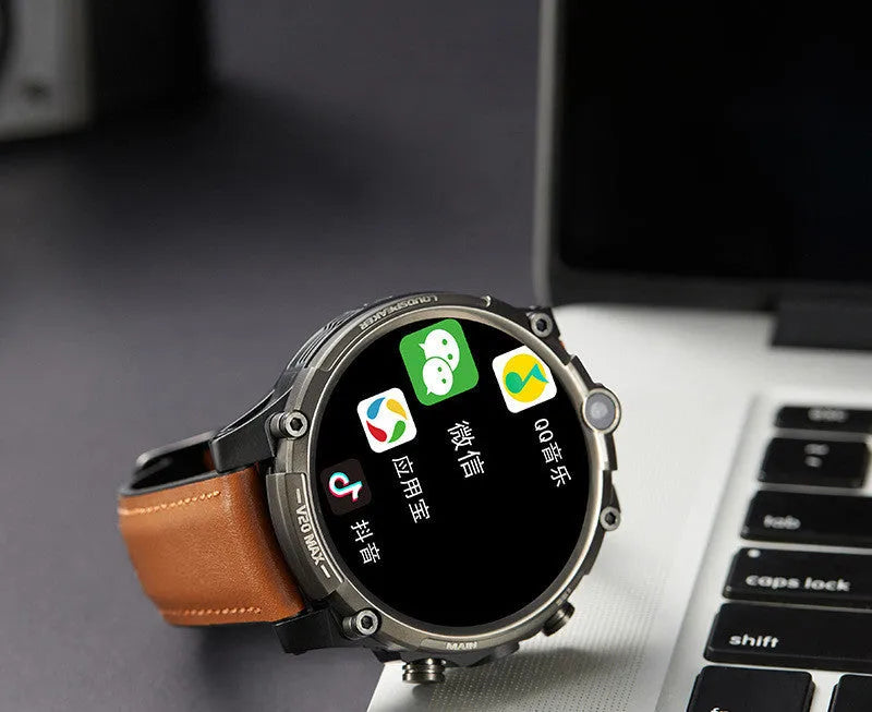 Black 4G smartwatch with a 1.6-inch screen, dual camera, and wrist strap displayed on a wrist.
