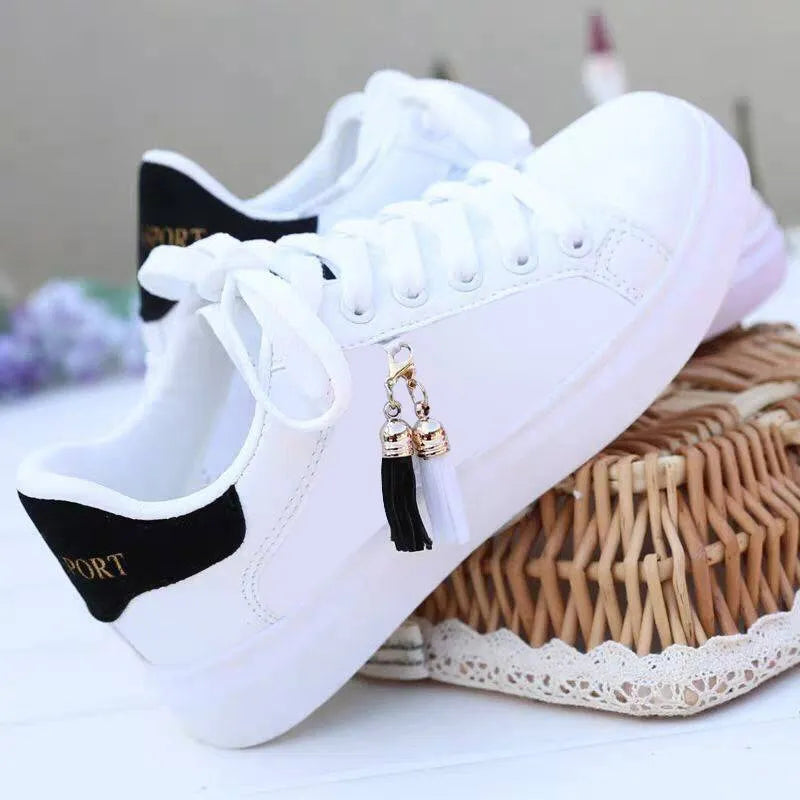 Women's white mesh fashion flats with 4cm heel in pink and black colours on a light background.