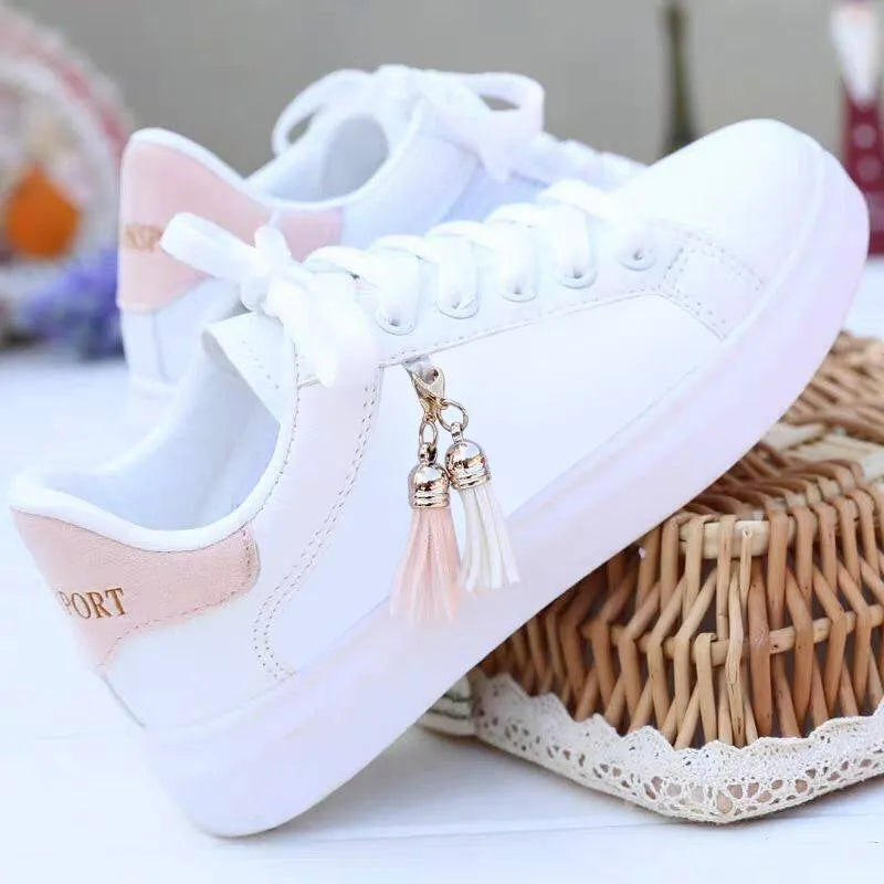 Women's white mesh fashion flats with 4cm heel in pink and black colours on a light background.