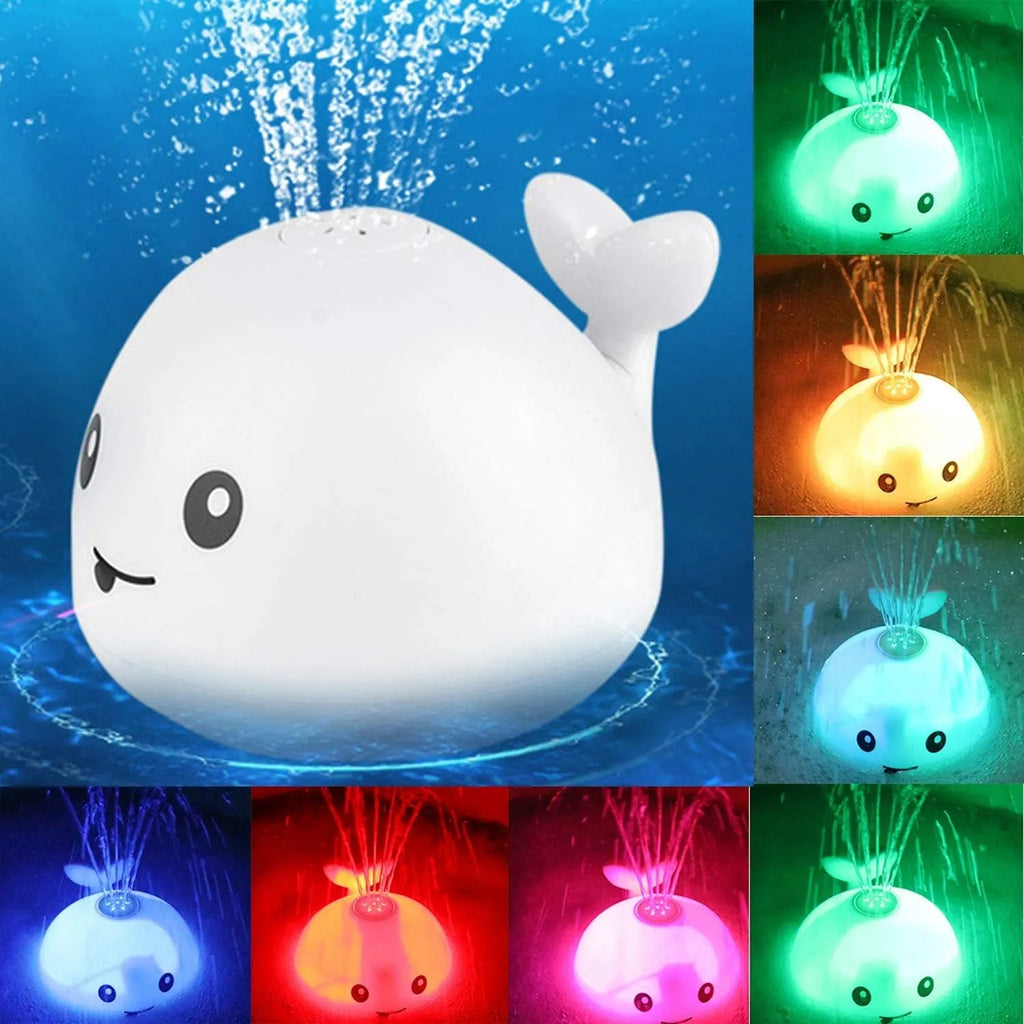 Automatic spray whale baby bath toy with LED lights on a blue base