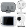 White 3.5 inch digital wireless baby monitor and UFO-style indoor camera on a table.