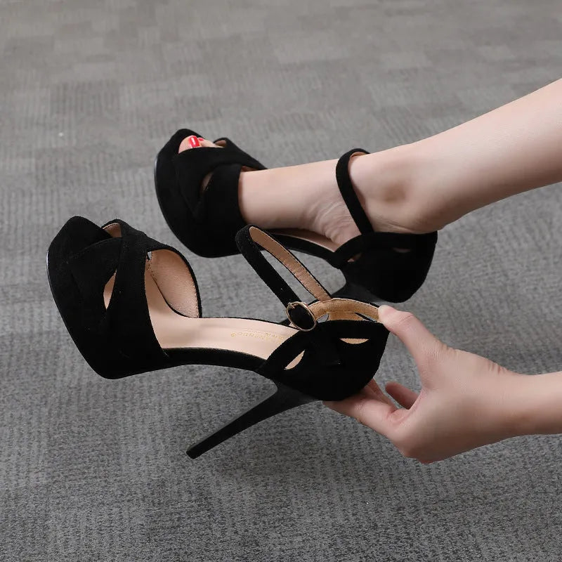 Black women's stiletto heel platform sandals with fish mouth toe and waterproof suede upper.