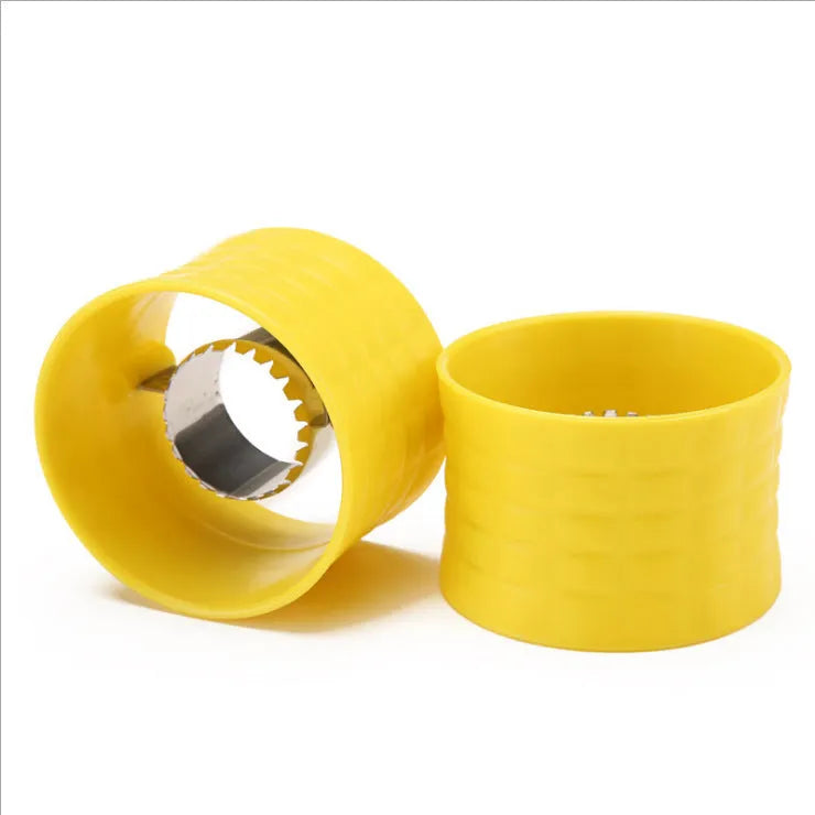 Yellow manual corn thresher kitchen gadget with corn-shaped design and stainless steel gear.