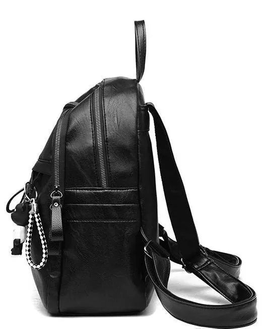Black PU leather backpack with luggage straps showing ID compartment and zipper opening