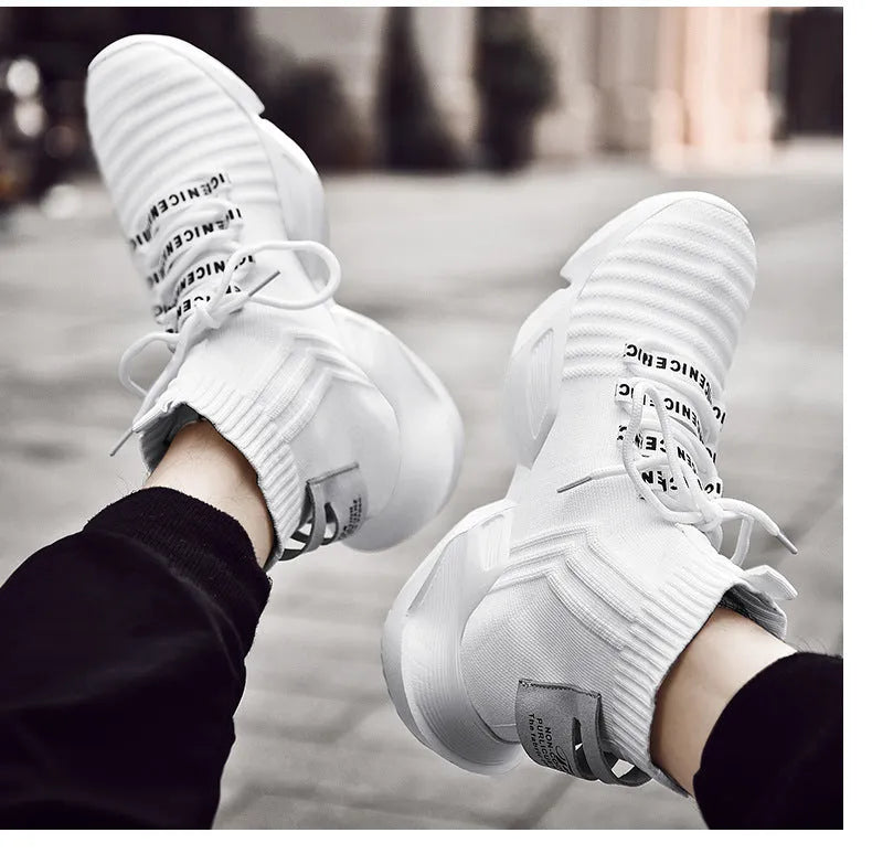 Men's black and white casual sports shoes with mesh lining, shown in larger sizes.