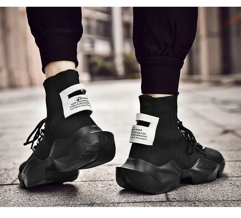 Men's black and white casual sports shoes with mesh lining, shown in larger sizes.