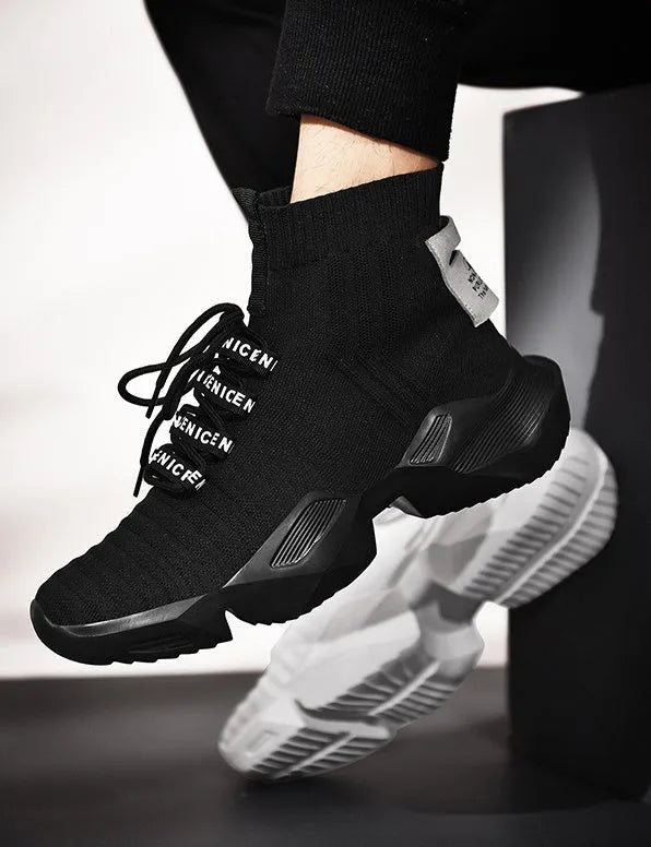 Men's black and white casual sports shoes with mesh lining, shown in larger sizes.