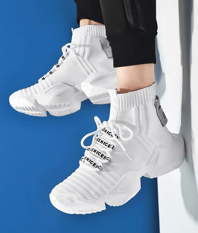 Men's black and white casual sports shoes with mesh lining, shown in larger sizes.